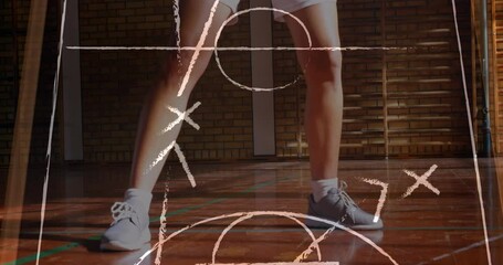 Animation of drawing of game plan over female basketball player