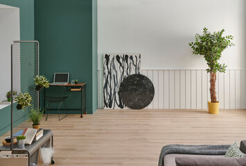 Decorative interior room concept, green and white decoration, vase of plant, parquet and working table style.
