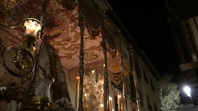 Procession of holy week in granada. Virgin procession through the streets of andalucia. act of christian faith in the procession of easter of resurrection.