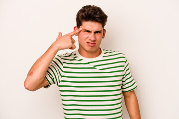 Fototapeta premium Young caucasian man isolated on white background showing a disappointment gesture with forefinger.