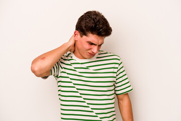 Young caucasian man isolated on white background suffering neck pain due to sedentary lifestyle.