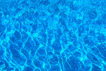 Clear water surface, rippled water in tiled swimming pool