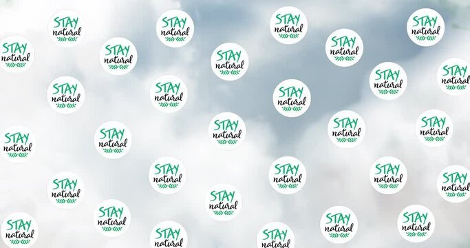 Animation of stay natural text over clouds and plants