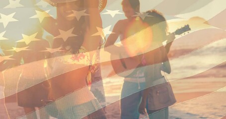 Animation of flag of united states of america over friends dancing and laughing at beach party - Powered by Adobe