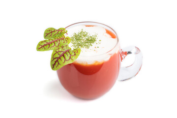 Tomato juice with sorrel and sour cream in glass isolated on white background. Side view, close up.