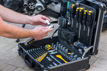 A technician man inspecting the case with the instuments