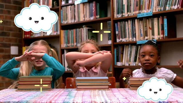 Animation of clouds and crosses moving over happy school children with books in library
