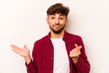 Young hispanic man isolated on white background showing that she has no money.