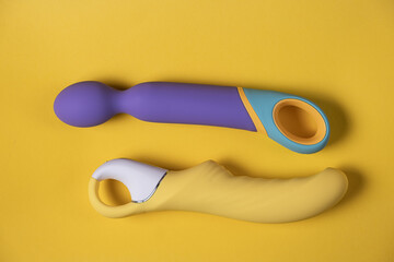 Sex toys. Many vibrators on a bright background. Useful for adult and sex shop