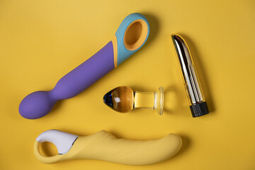 Sex toys. Many vibrators on a bright background. Useful for adult and sex shop