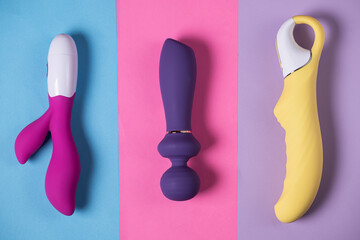 Sex toys. Many vibrators on a bright background. Useful for adult and sex shop