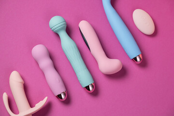 Sex toys. Many vibrators on a bright background. Useful for adult and sex shop