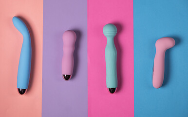 Sex toys. Many vibrators on a bright background. Useful for adult and sex shop