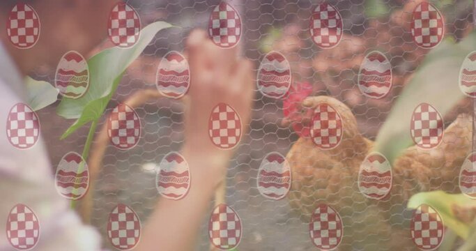 Animation of egg pattern over asian boy and chicken