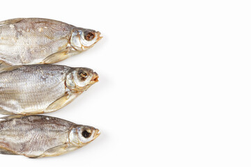 Dried fish isolated on white background. Salty dry river fish. Copy space for a text
