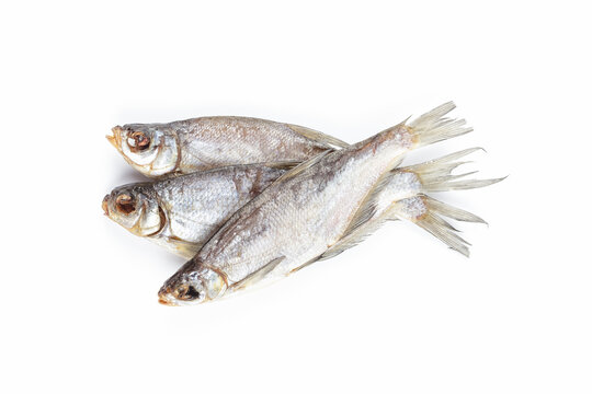 Dried fish isolated on white background. Salty dry river fish. Top view