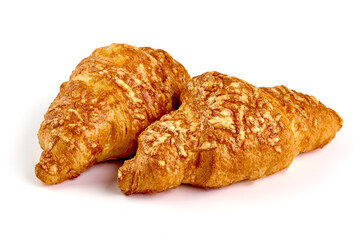 Freshly baked croissants, isolated on white background.