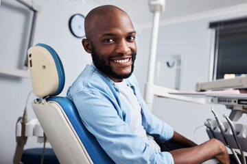 I got my smile back. Portrait of a young man having dental work done on his teeth.