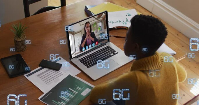 Video of digital interface and 6g text over african american woman using laptop - Powered by Adobe