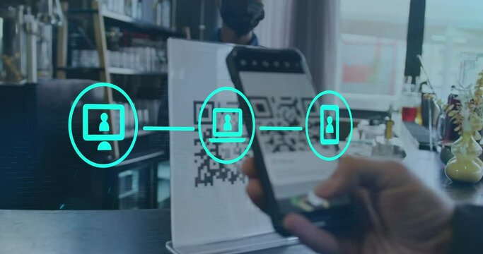 Neon digital icons against mid section of a person scanning a qr code at a cafe