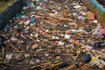 Semarang, Indonesia - April 11, 2022: Piles of garbage in a stagnant river.