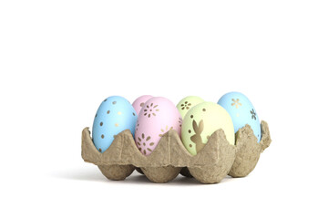 Colored Easter eggs in the tray. White background. Space for copying. Minimalistic style.
