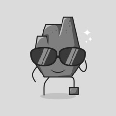 cute stone cartoon with smile expression. black eyeglasses, one leg raised and one hand holding glasses. suitable for logos, icons, symbols or mascots. grey