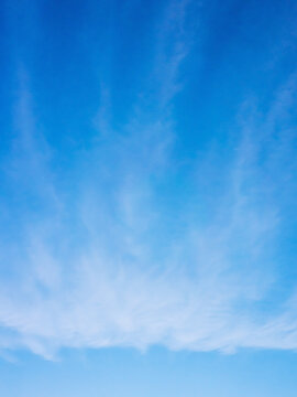 Blue sky with clouds, natural vertical background