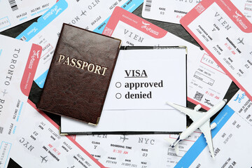 Flat lay composition with passport, toy plane and tickets on black table. Visa receiving
