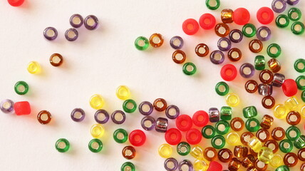 Glass beads mix. Different colors. Isolated on white background, top view.