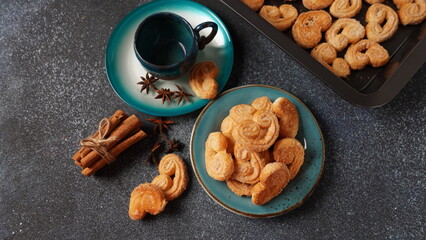Palmier biscuits - french cookies made of puff pastry also called palm leaves, elephant ears or french hearts - obrazy, fototapety, plakaty