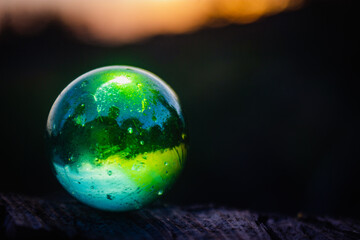 green translucent sphere in black background