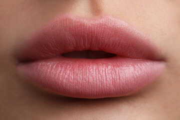 Young woman with beautiful lips, closeup view