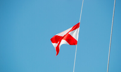 nautical signal flag on a boat moored.