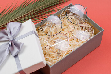 Stylish women's eyeglasses in a gift box. Gift or sale of stylish optical glasses