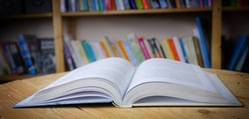 Empty wooden table on library background. Copy space