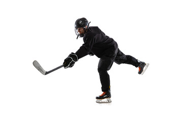 Professional male sportsman, hockey player training isolated over white studio background. Active lifestyle