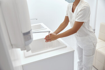 Close Up Of Medical Staff Washing Hands.Disinfect their Hands Before Surgery.