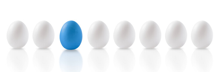 Seven white and one blue egg on a white background.