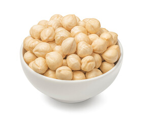 Bowl of peeled hazelnuts isolated on white background. Top view.