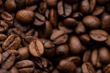 A macro shot of a pile of coffee beans