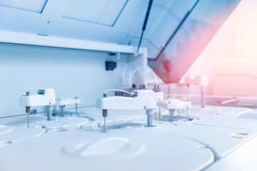 Closeup modern robotical machine for centrifuge testing sample tube with blood. Medical laboratory...