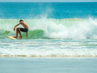 Surfer at Clarkes Beach, Byron Bay