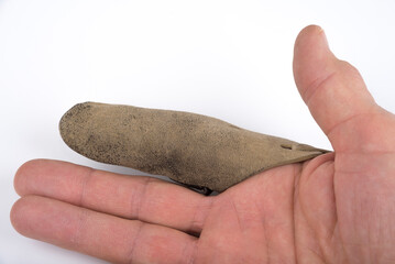 Obraz premium Retro Leather Finger Guards on a index finger on a white