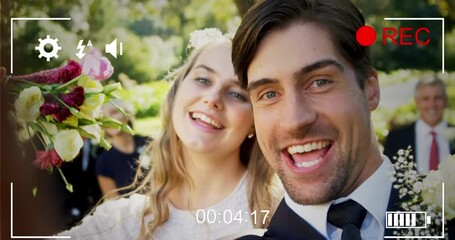 Animation of digital camera interface over caucasian married couple smiling to camera