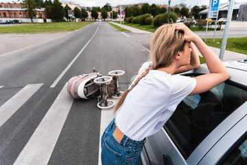Horrified driver after a car accident with baby pram on the crosswalk