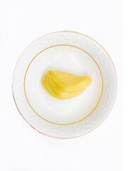 a pieces of Jack fruit in plate isolated on a white background, top view