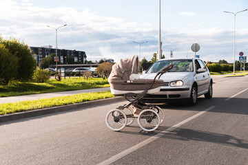 Outraged driver and baby pram rolled out in the middle of the road