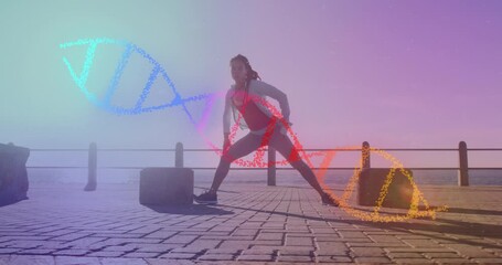 Animation of dna strand over biracial woman stretching on promenade - Powered by Adobe