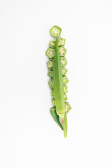 slices and whole of okra or Lady Finger isolate on white background, top view